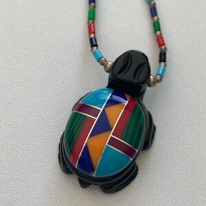 Vintage Zuni Hand Carved Turtle Pendant with inlaid gem and sterling chain